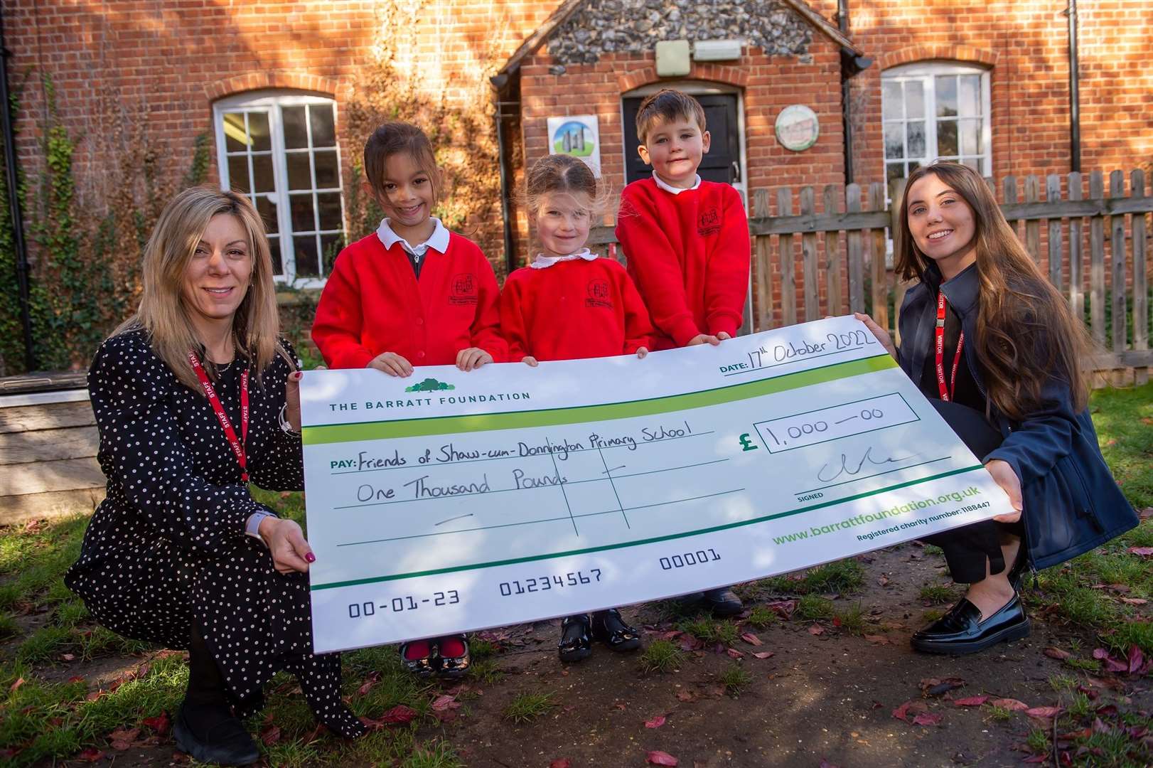Shaw-cum-Donnington Primary School pupils celebrating the donation