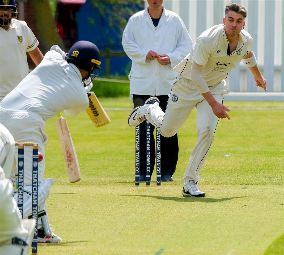 Mike Green bowls Sarang Ravindra