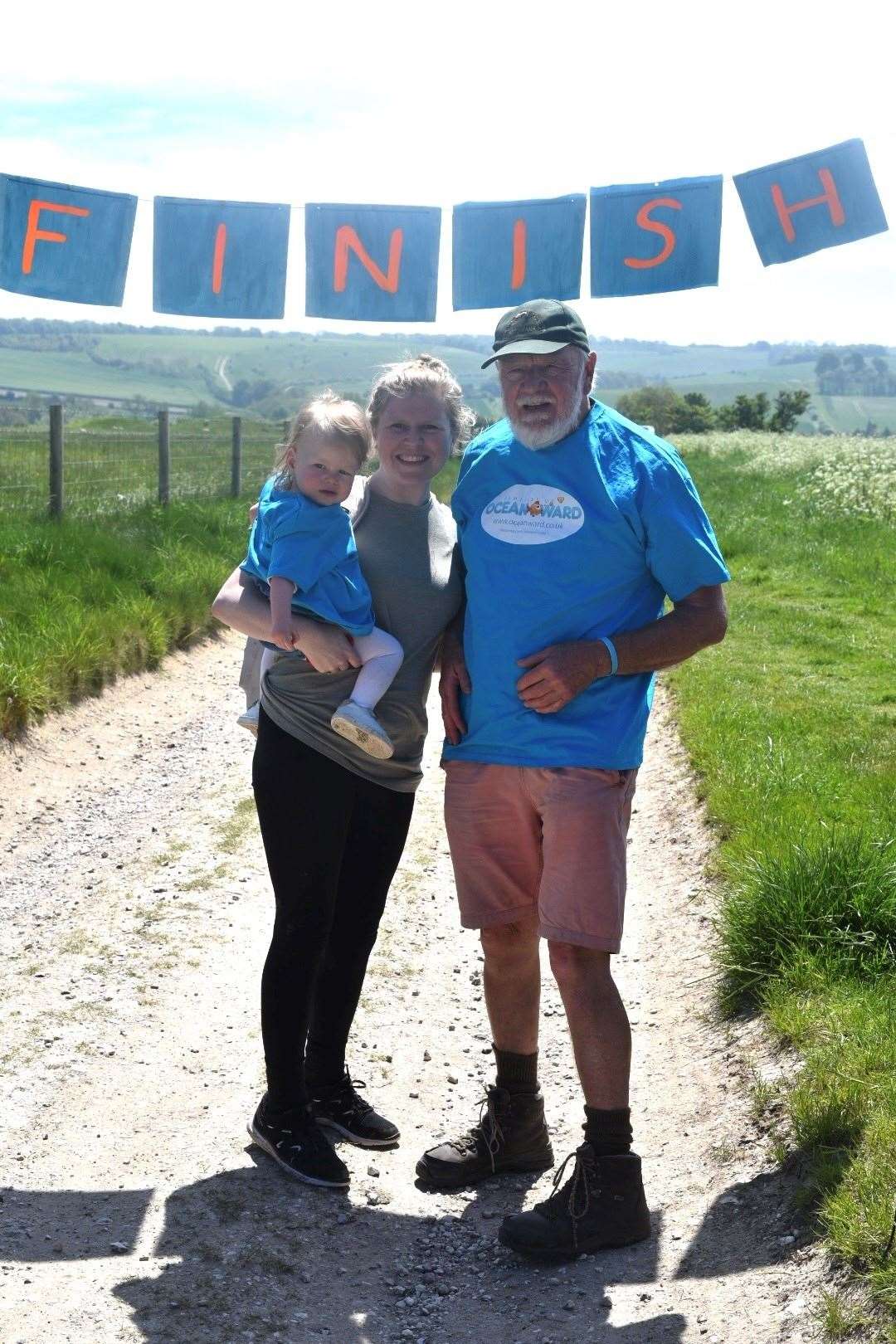 Robin Busby with his granddaughter Esme Taheny and her mother Charlotte Busby