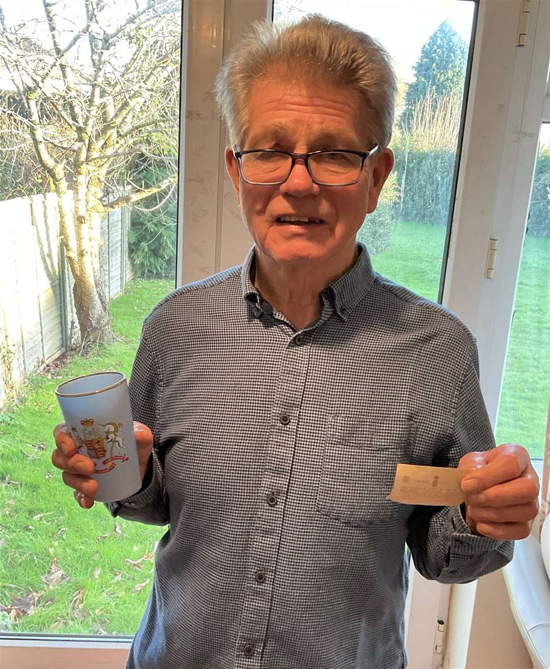Colin Young with his souvenir beaker presented to him at age six
