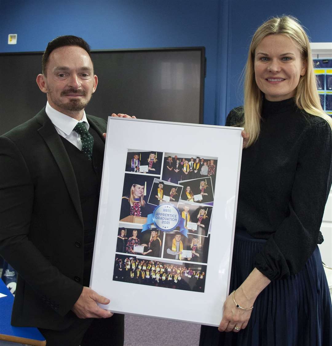 Matt Garvey (MD of WBTC) presenting Laura Farris with compilation picture from WBTC’s Graduation