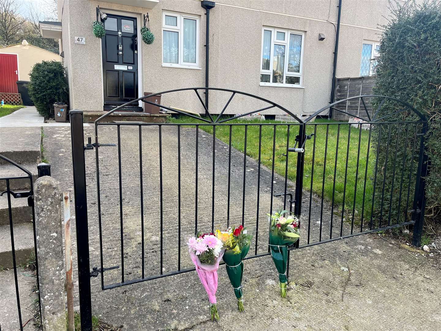Floral tributes left near the scene on Cobhorn Drive (Rod Minchin/PA)