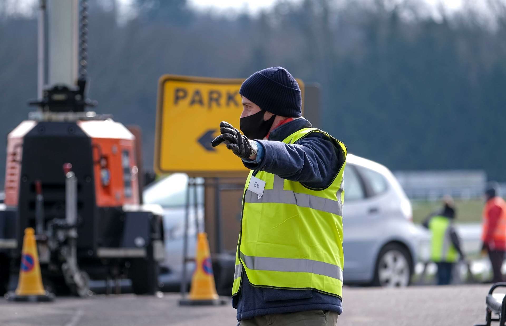 Ed Tryon directs cars at the vaccination centre