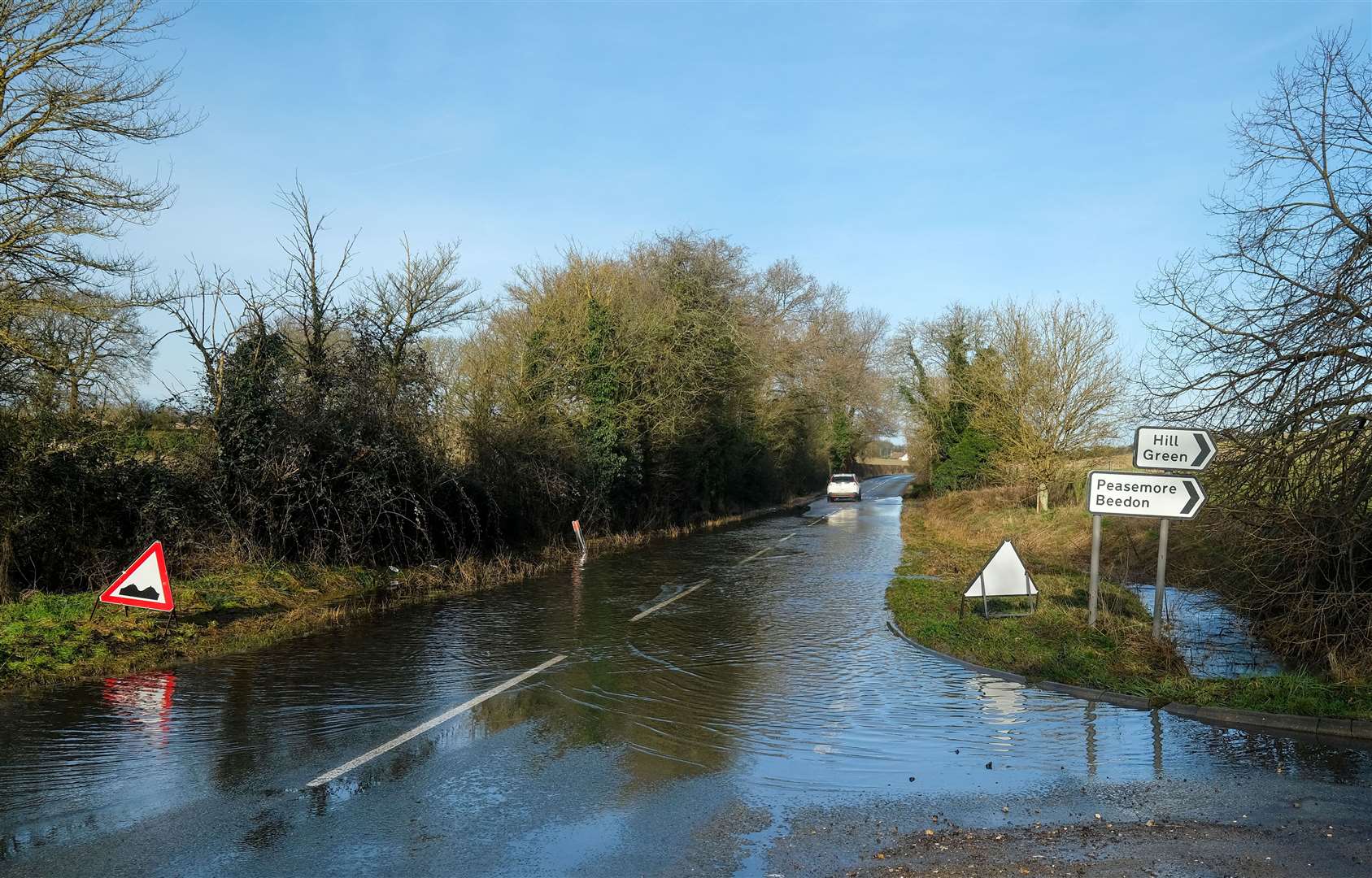 Potholes covered in flood water along B4494