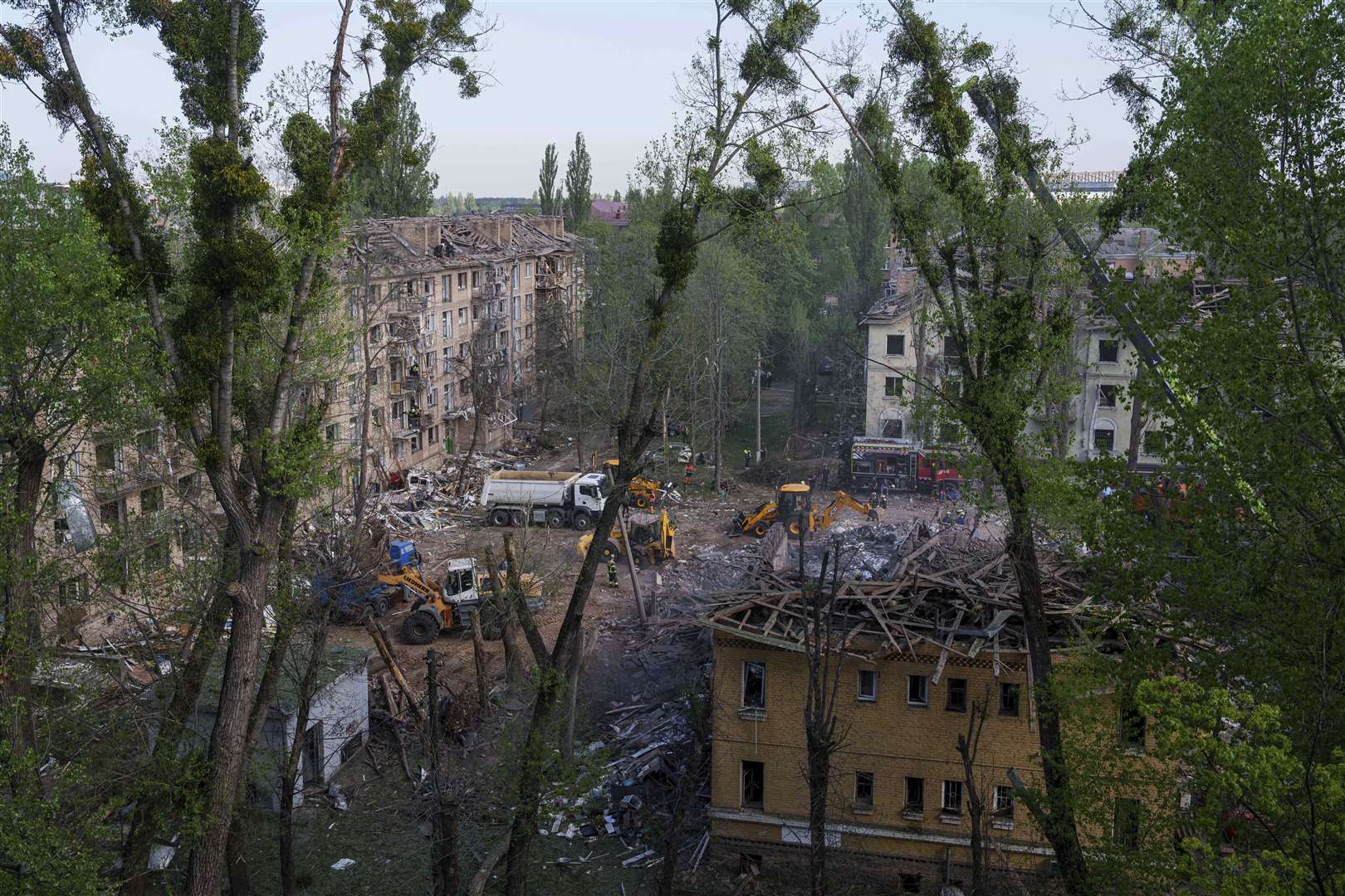 Rescue workers clear the rubble of a house destroyed by a Russian strike on a residential neighbourhood in Kyiv on Thursday (AP Photo/Evgeniy Maloletka)