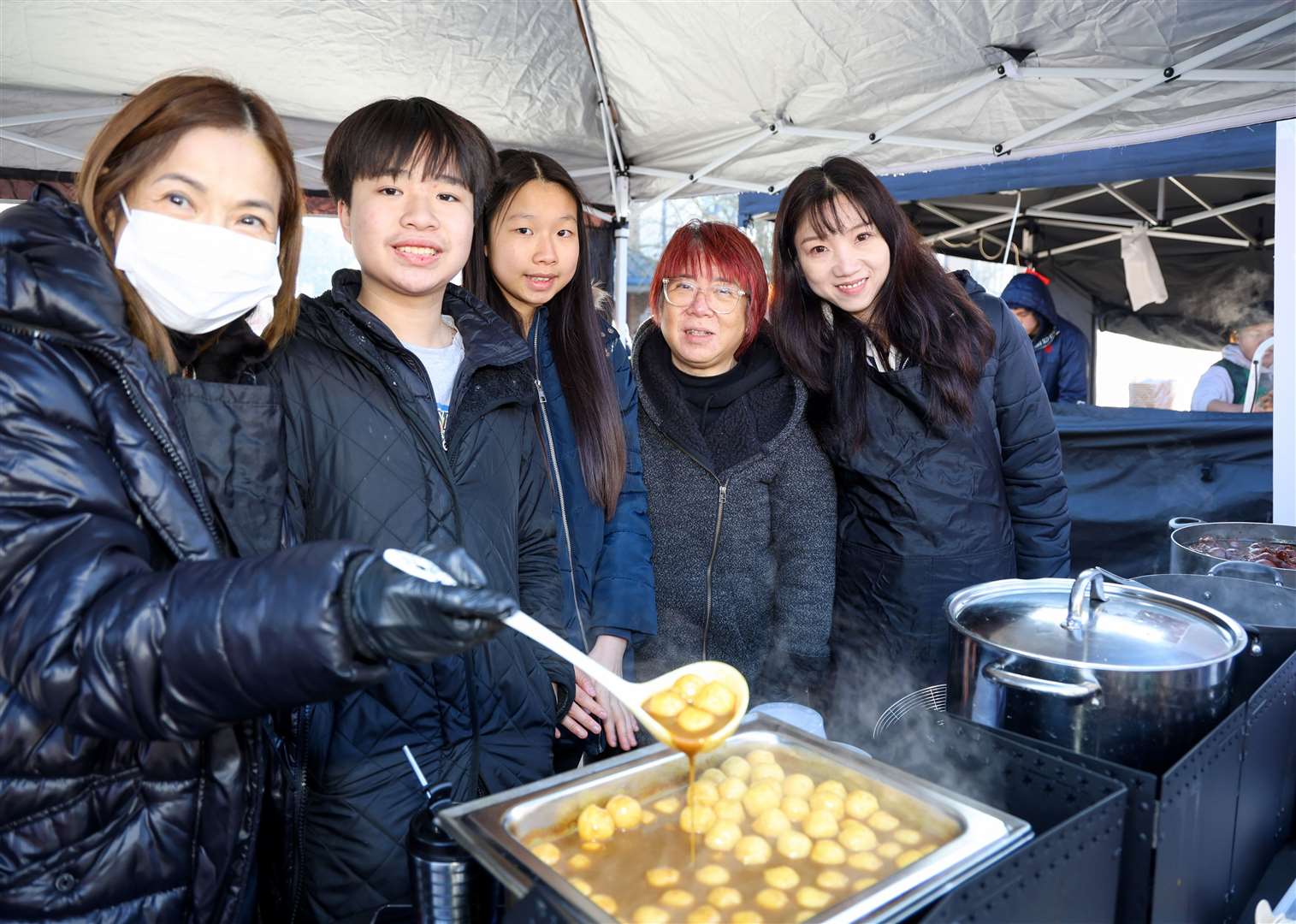 Visitors enjoying traditional Asian cuisine