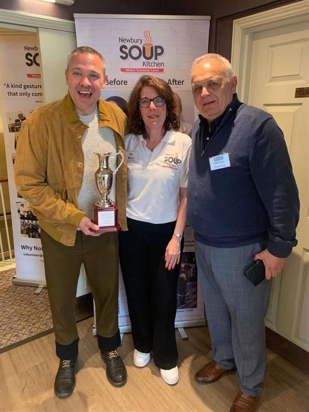 Will Young, Meryl Prail and George Darling, a new member to the Newbury Soup Dragon Breakfast Club, with the golf day cup