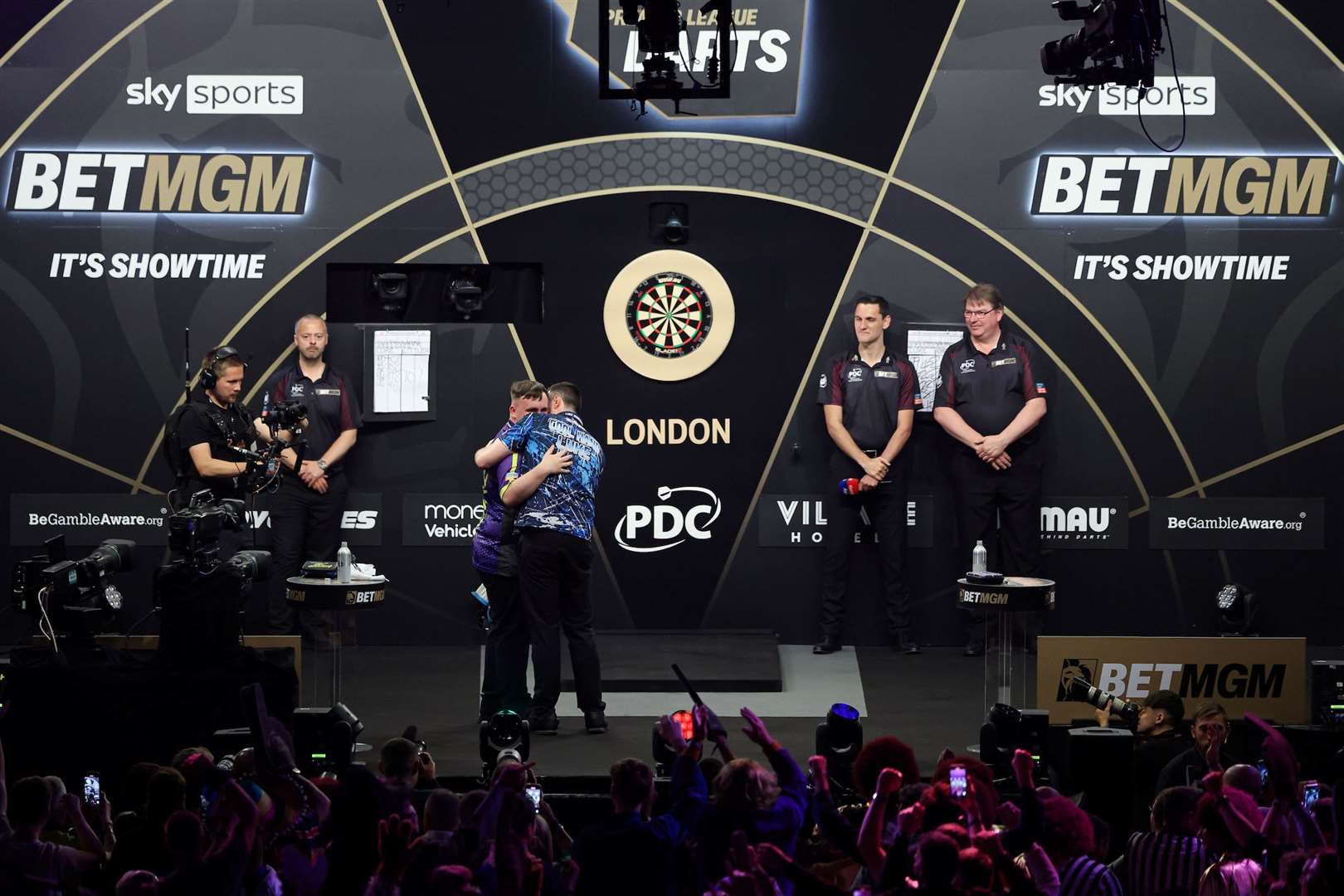 Luke Humphries and Luke Littler embrace after another fantastic duel - (PDC)