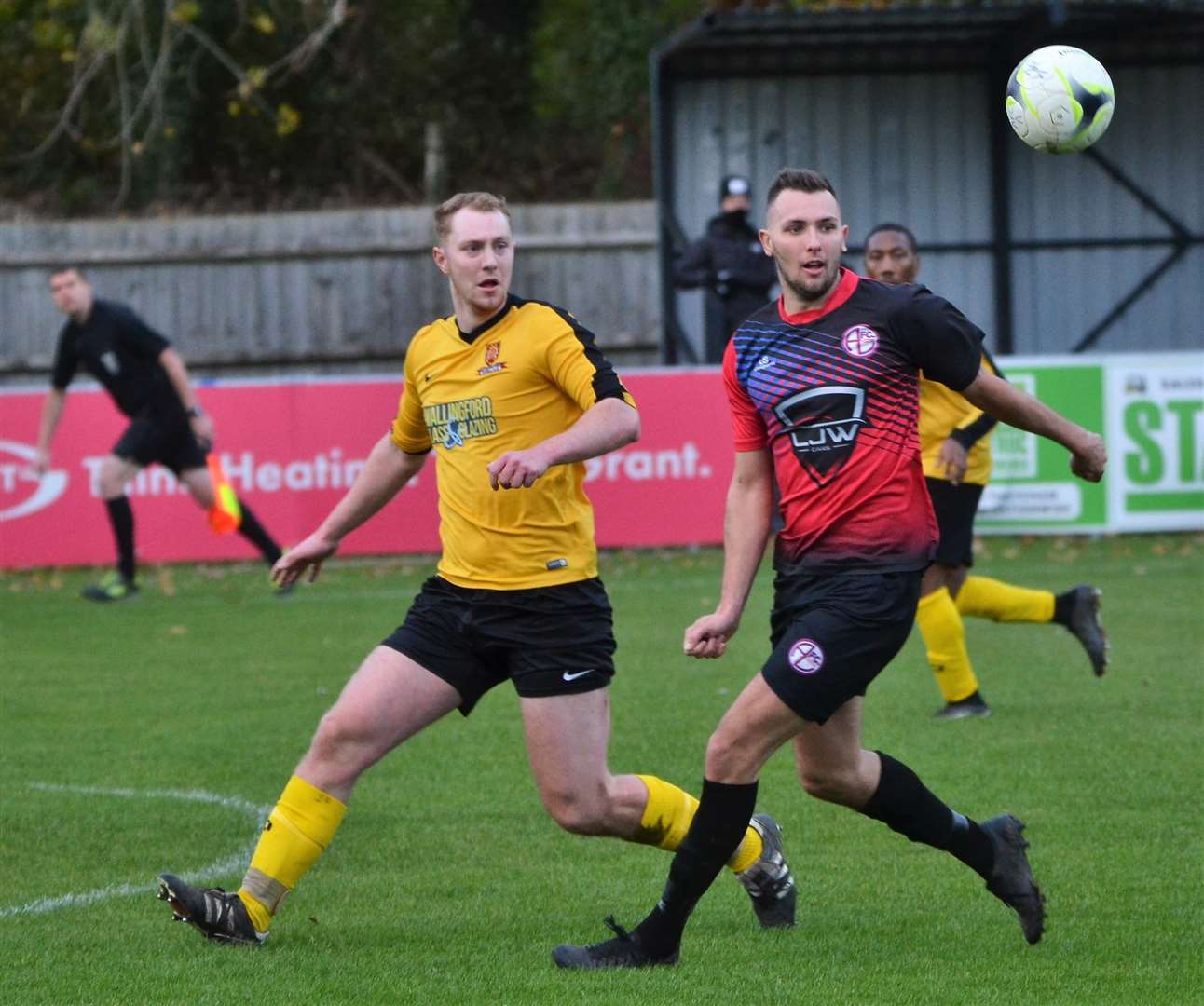 Two players have eyes for the ball