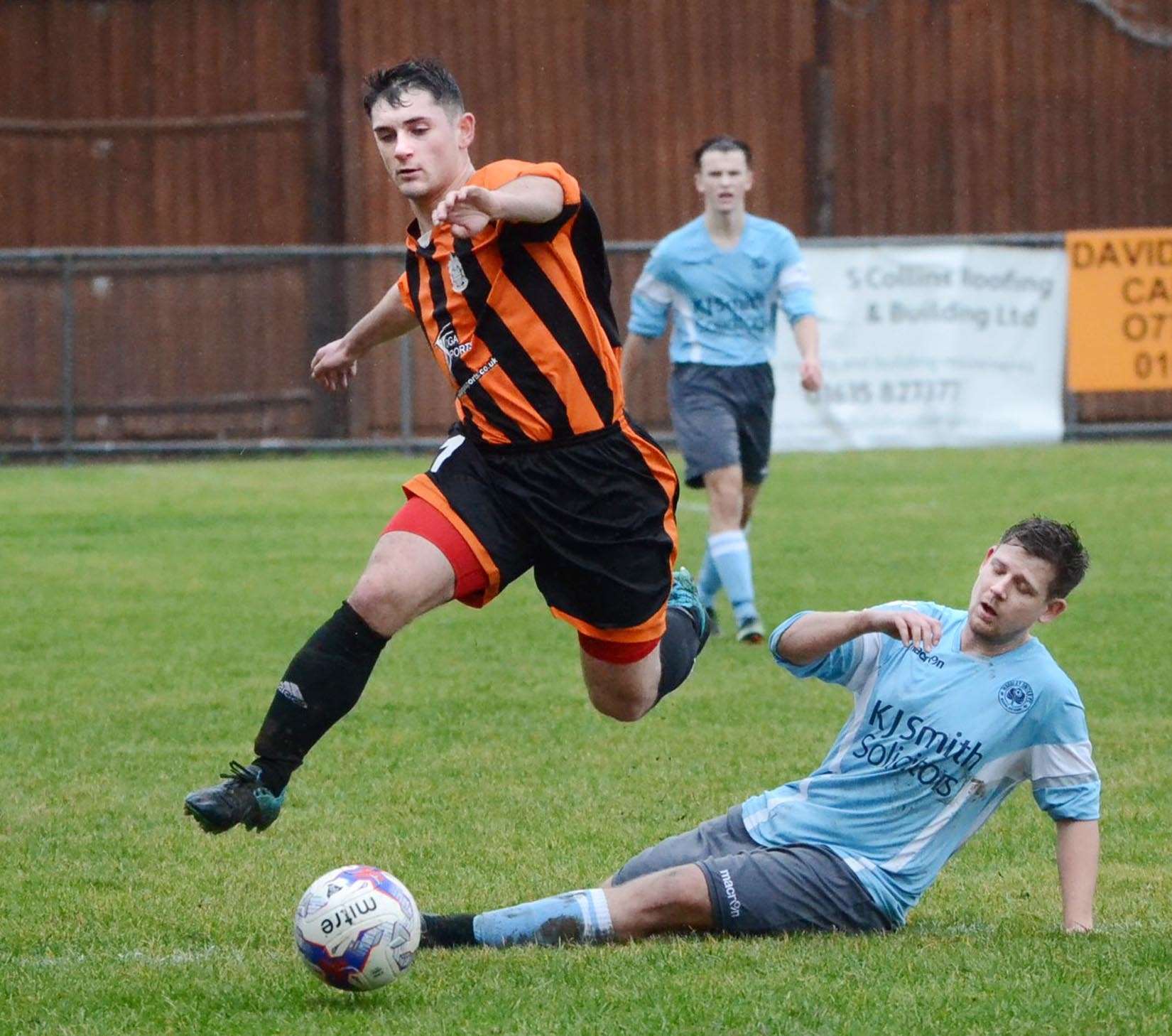 Newbury's Brad Pagliaroli hurdles a challenge in the win over Woodley United Royals