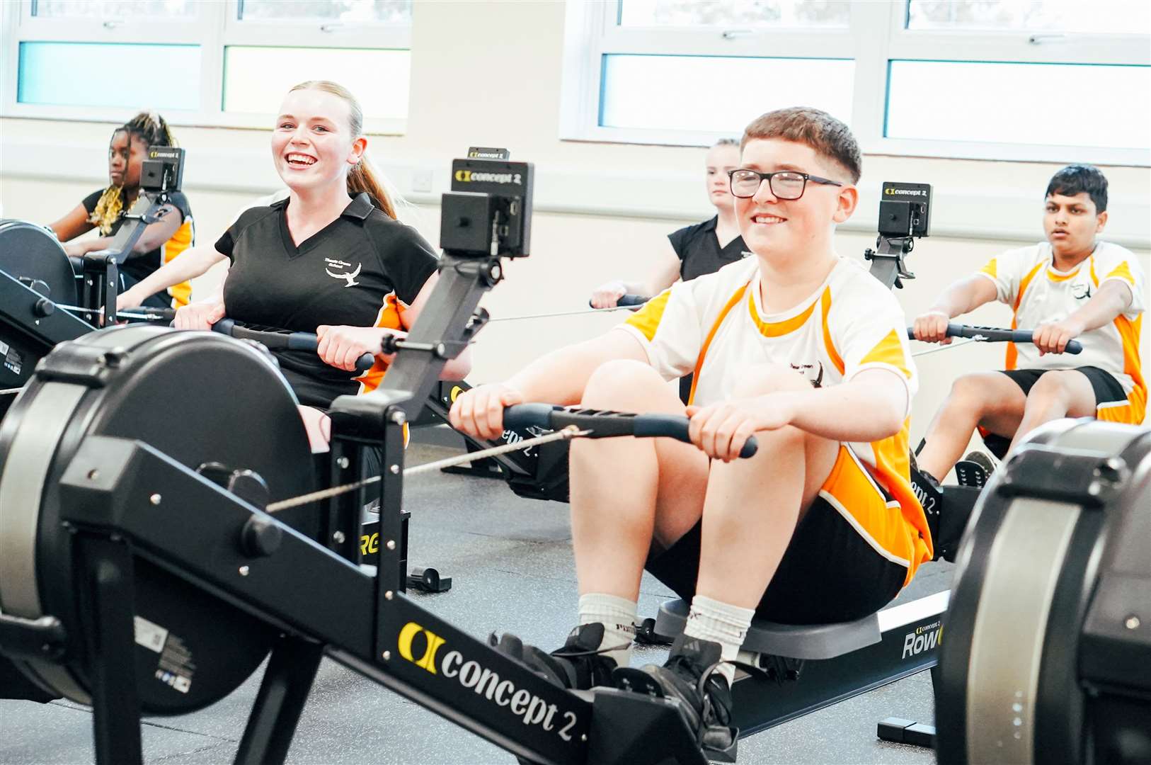 Pupils enjoying using the rowing machines