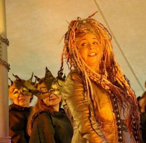 Boxford masques Lizzie Lewis as Delphi, backed by Polly Stevens and Mia Potts