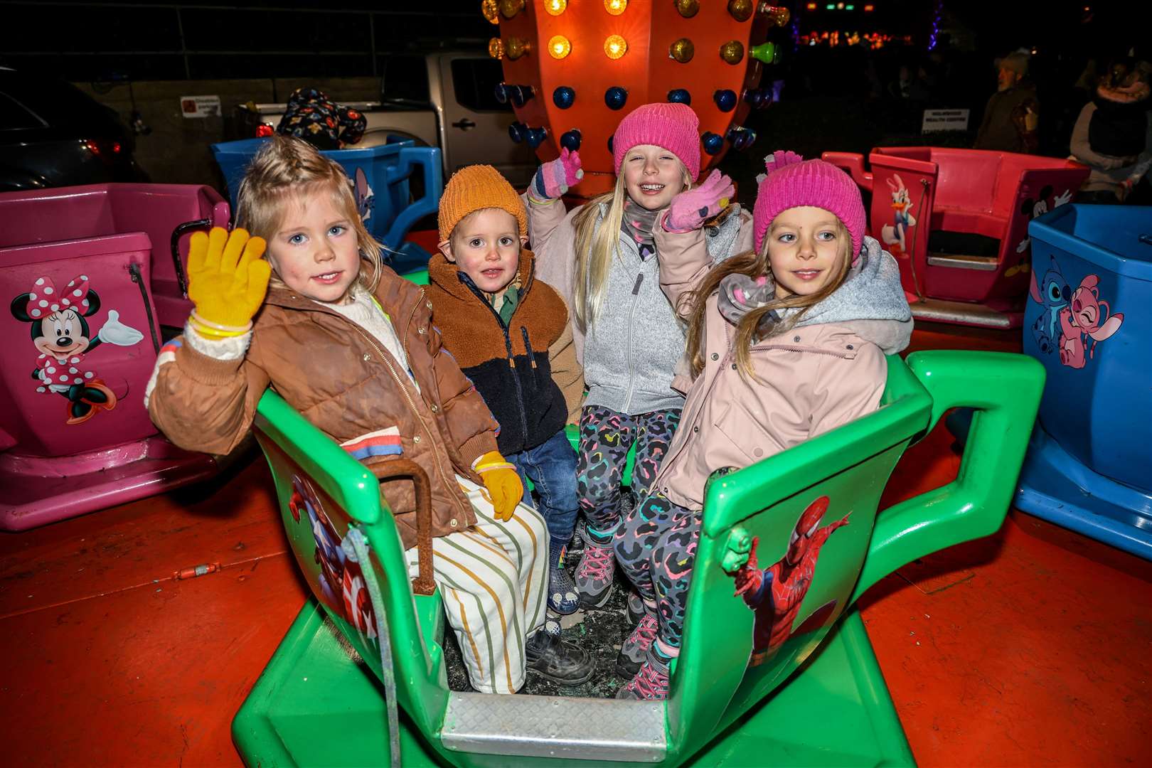 Children enjoying the merry-go-round