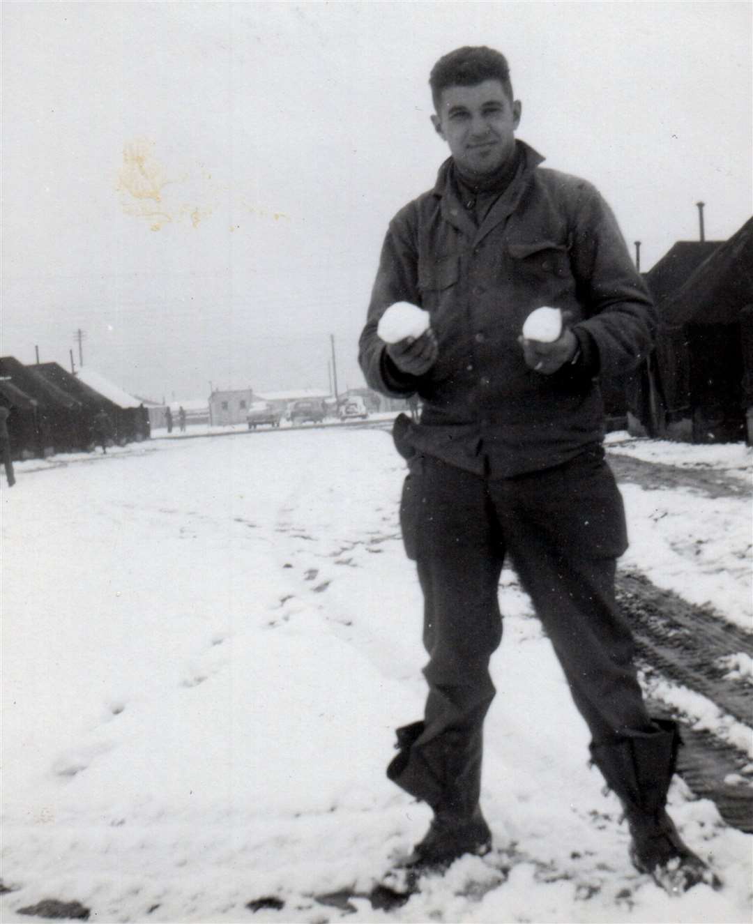 George Tiss in the ‘Company Area’ enjoying no work due to snow one Saturday in February 1953. ‘This is the biggest snowfall we had in England. It was nice and warm outside even though it snowed’, writes George