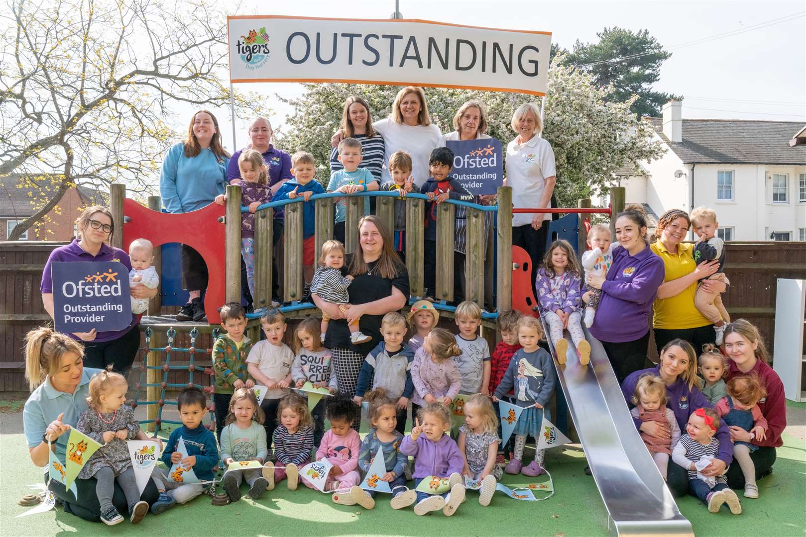 Owner Alison Huntley with manager Vicky Attard and staff and children from the nursery.