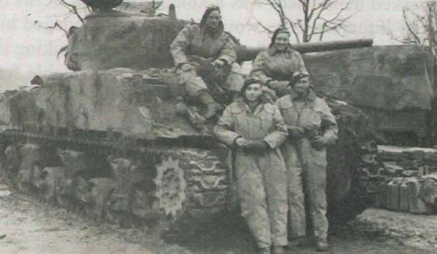 Cecil, bottom right, standing with his Sherman tank crew in November 1944