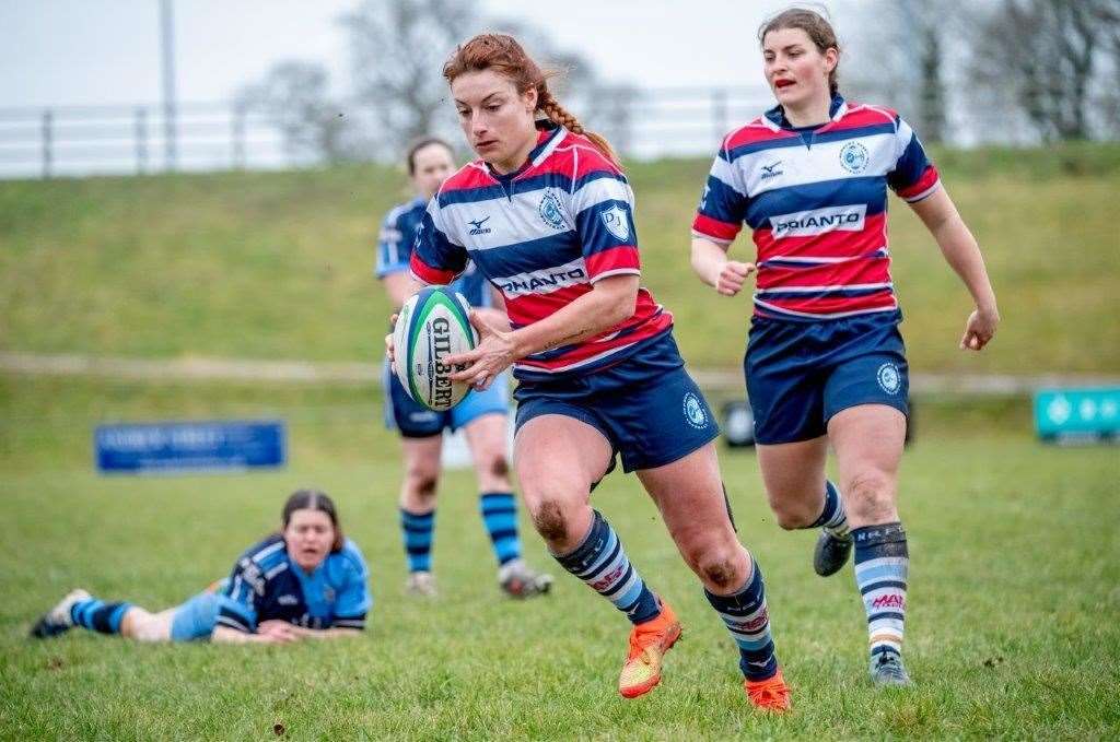 Lizzie Harris scores a sensational solo try. Pic: Alastair Gray