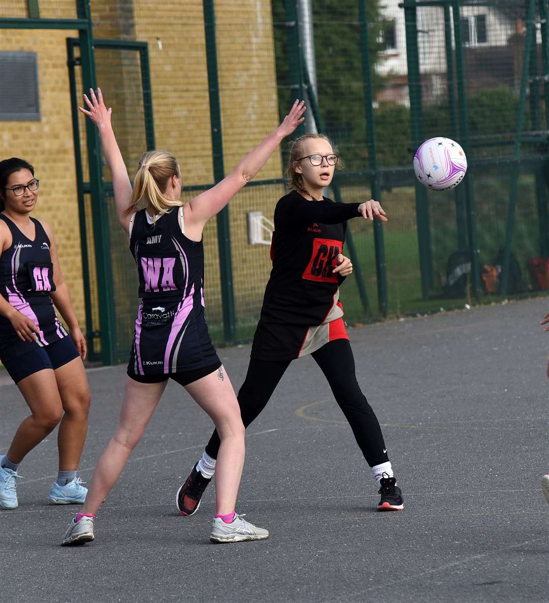 A Newbury player tries to find a teammate