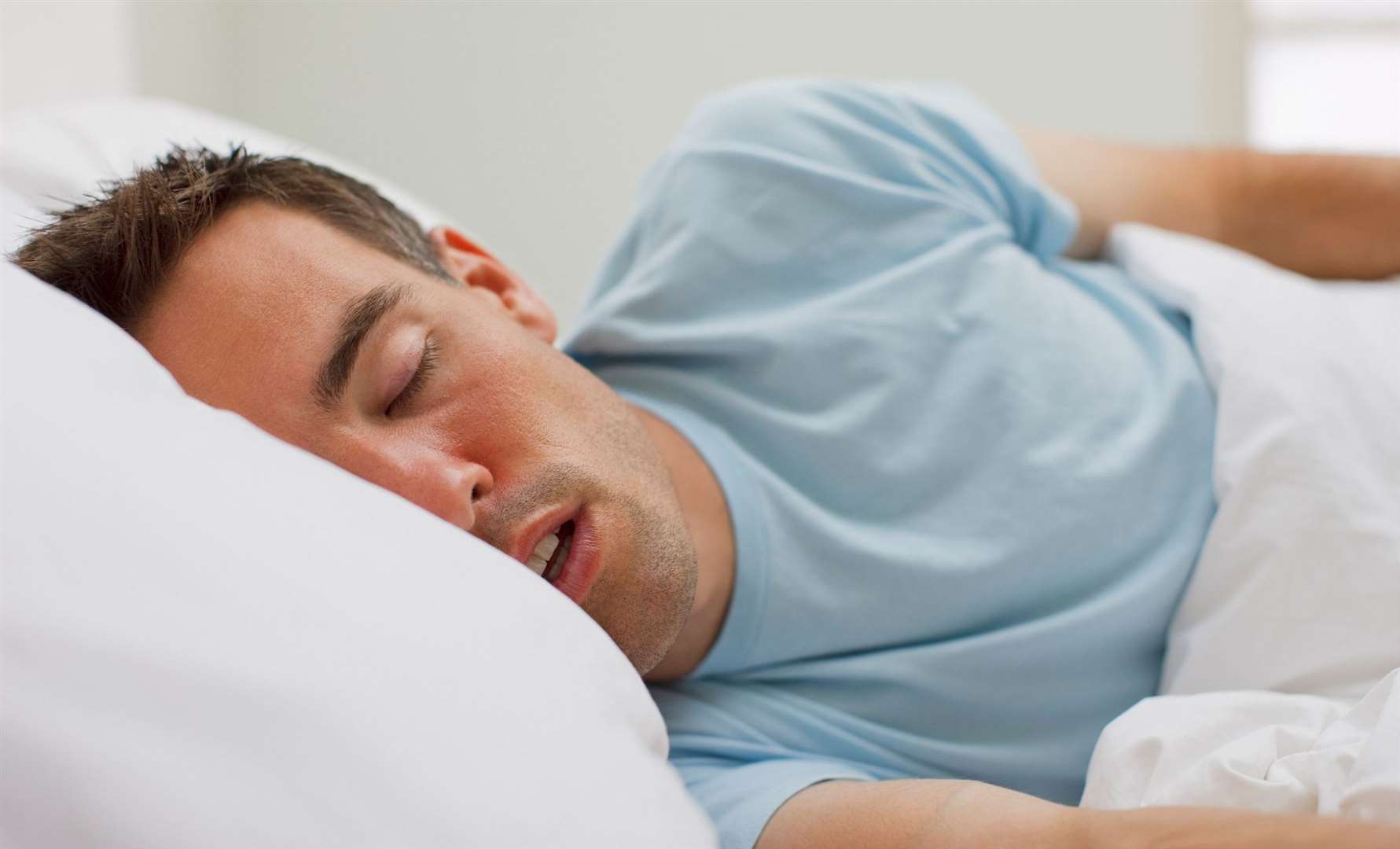 Sleeping on your side can help open up your airway, resulting in quieter breathing