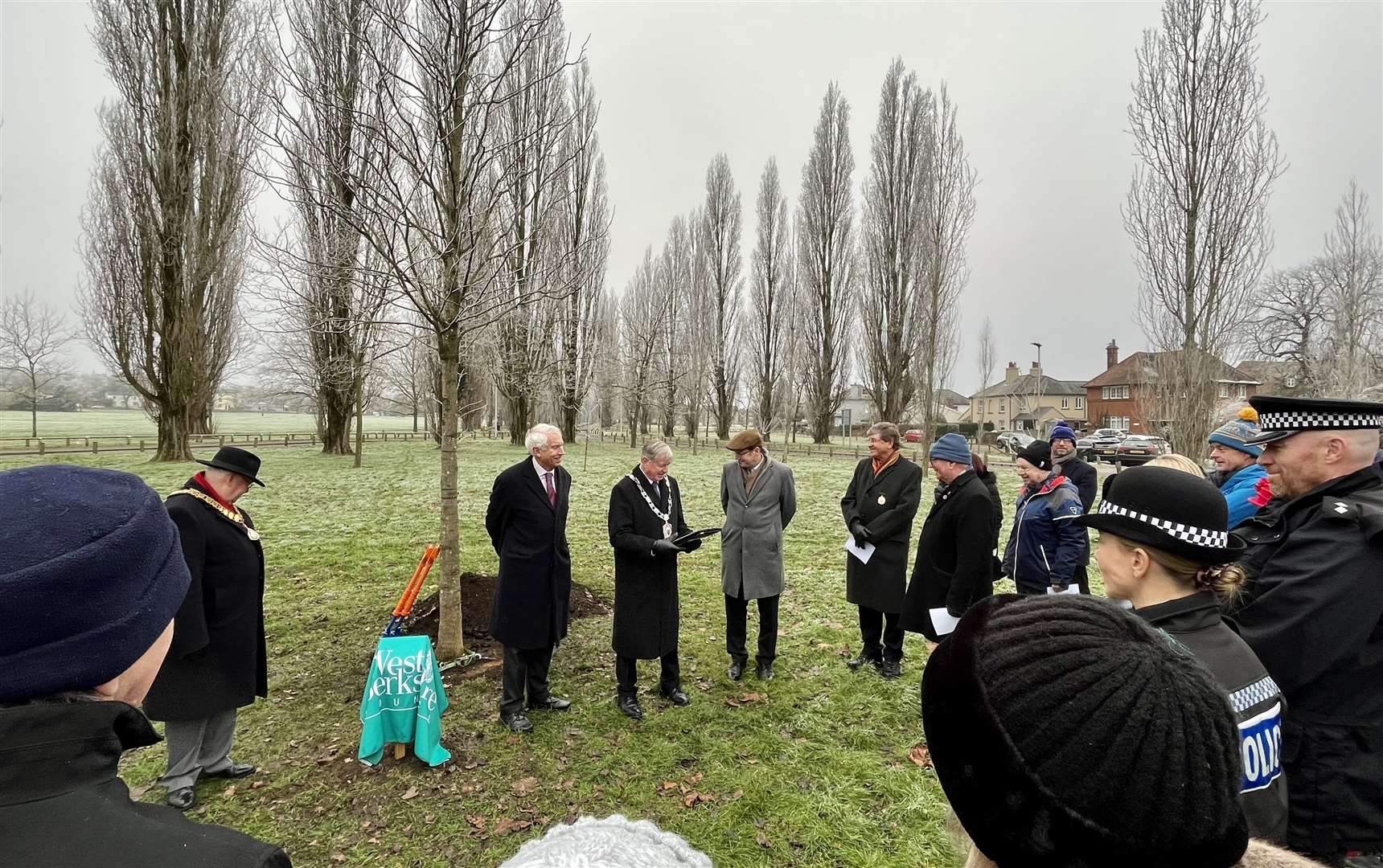 Various dignitaries attending Her Late Majesty's memorial tree unveiling, including Thames Valley Police and the Newbury Weekly News