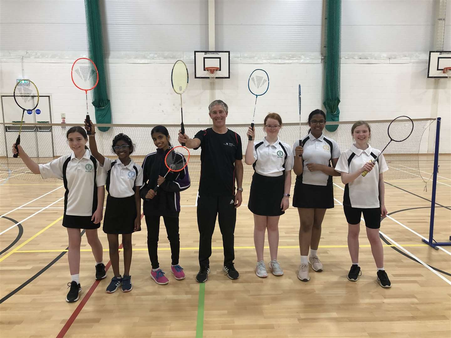 The badminton club at St Bart's School with coach Malcolm Taylor