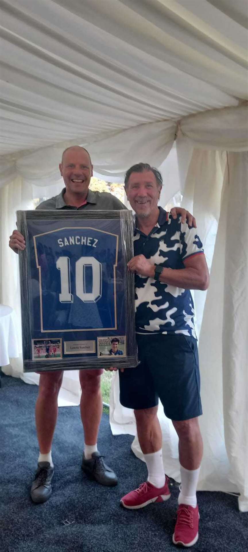 Lawrie Sanches with his donated signed shirt at the New Life golf day at Calcot Golf Club