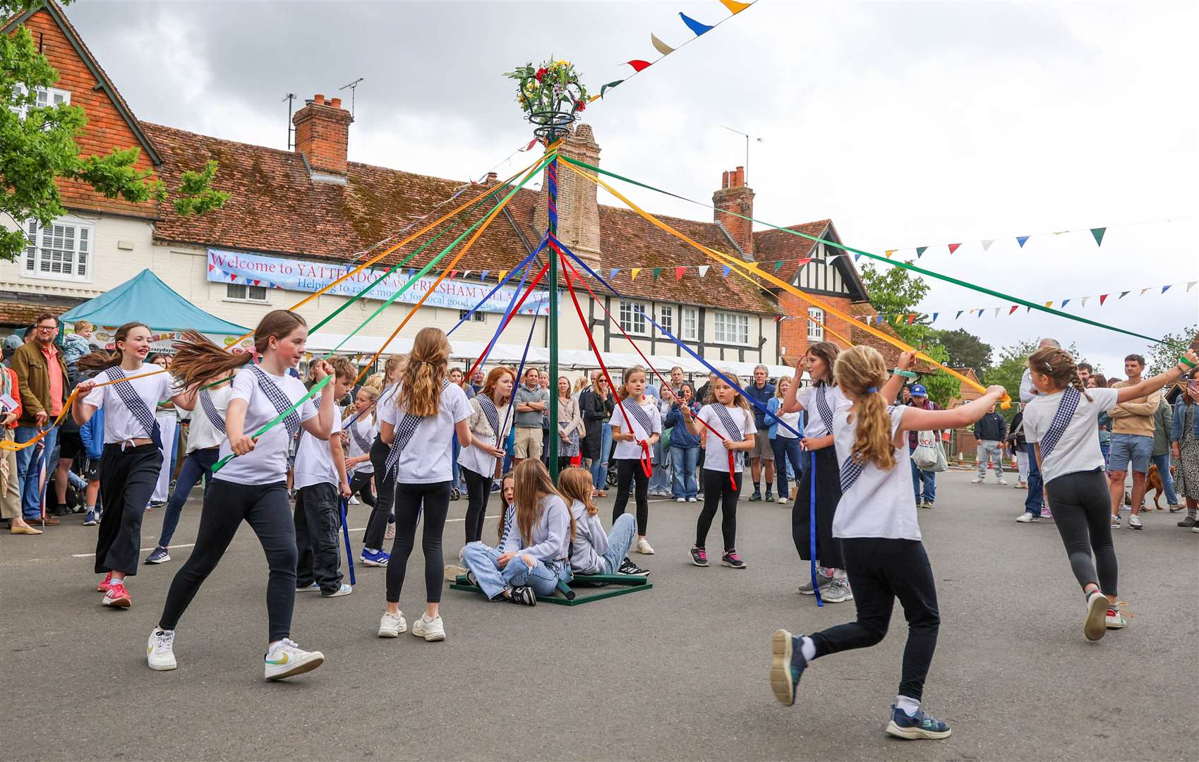 Children dancing around the maypole