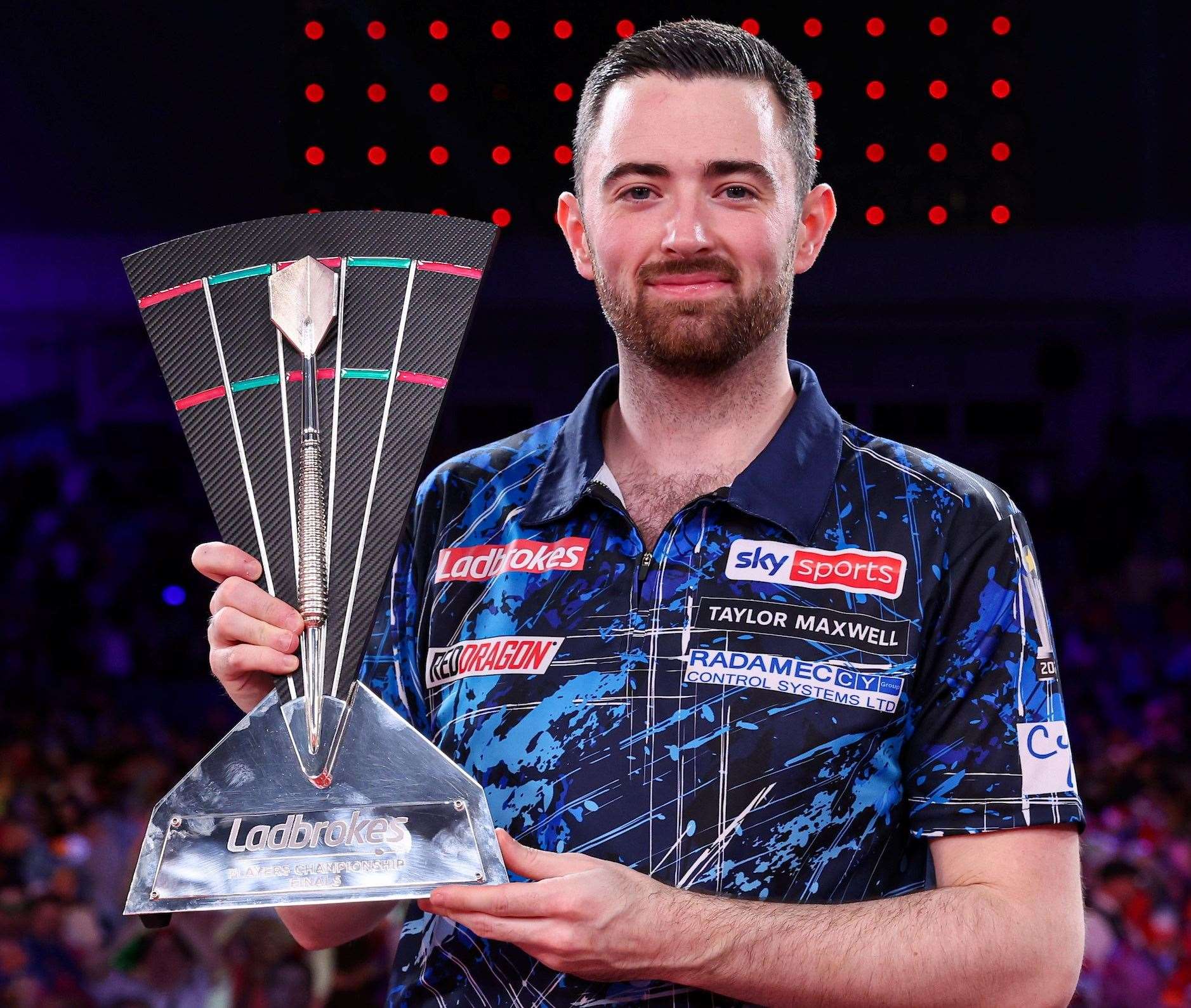 Luke Humphries celebrates retaining the Players Championship, after defeating Luke Littler - Photo: Kieran Cleeves/PDC
