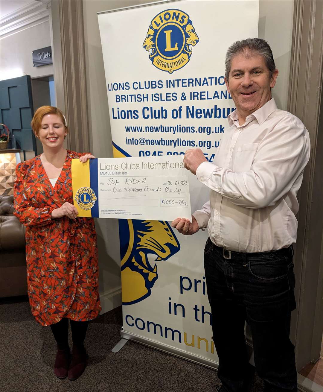 President John Coleman making a presentation to Hannah Richards of the Sue Ryder Foundation to support the work of the Duchess of Kent Hospice