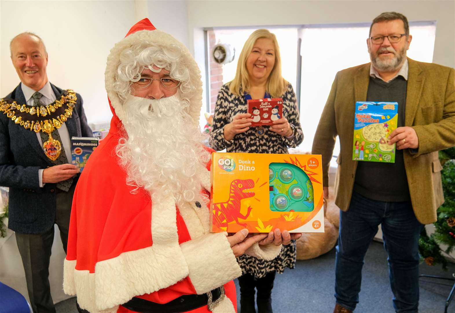Mayor of Newbury Nigel Foot, Father Christmas, deputy mayor of Thatcham Suzanne Adamantos and Newbury Community Resource Centre chief executive Kelvin Hughes