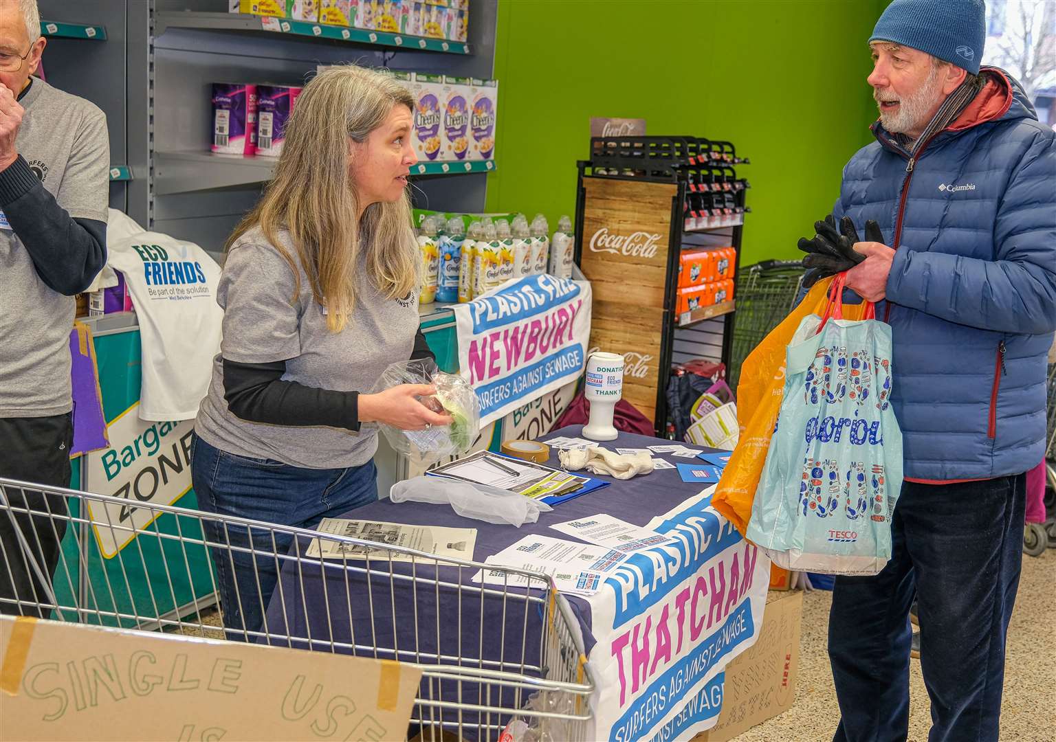 Shoppers leaving their plastics with volunteers