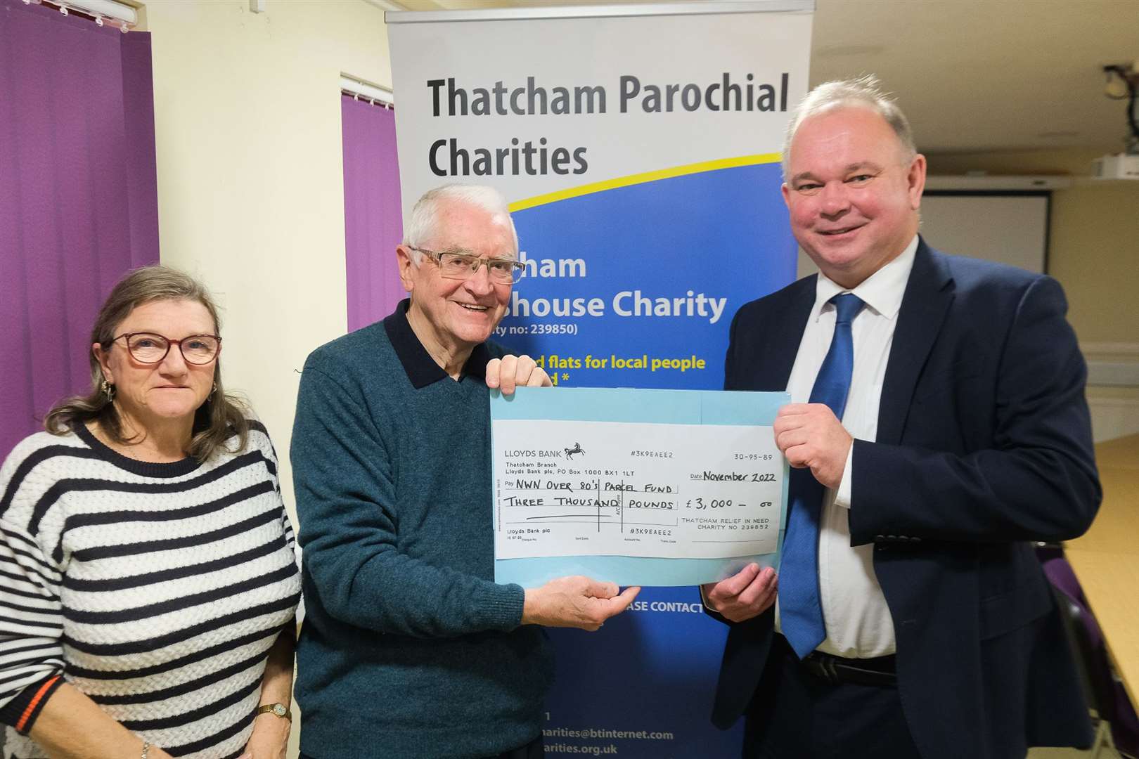 Christine Rice, trustee of Thatcham Parochial Charities and Chris Druce, chair of Thatcham Parochial Charities present a cheque to Andy Murrill, editor of Newbury Weekly News