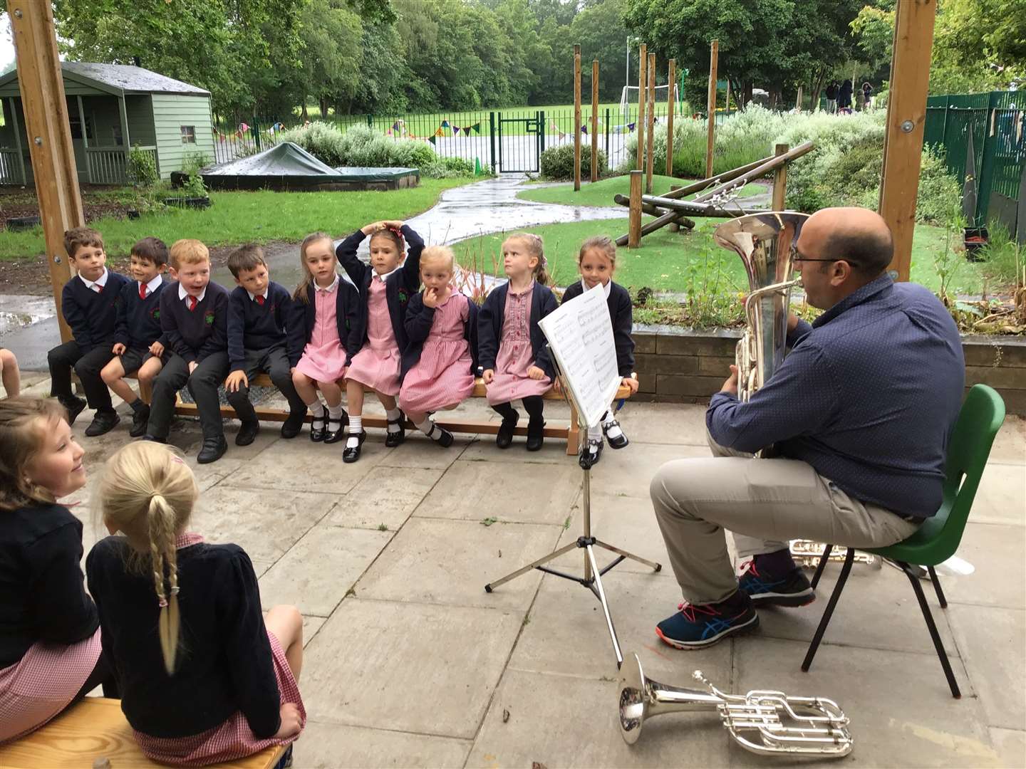 Watership Brass player Tony Howes playing to KS1 pupils outside (48661625)