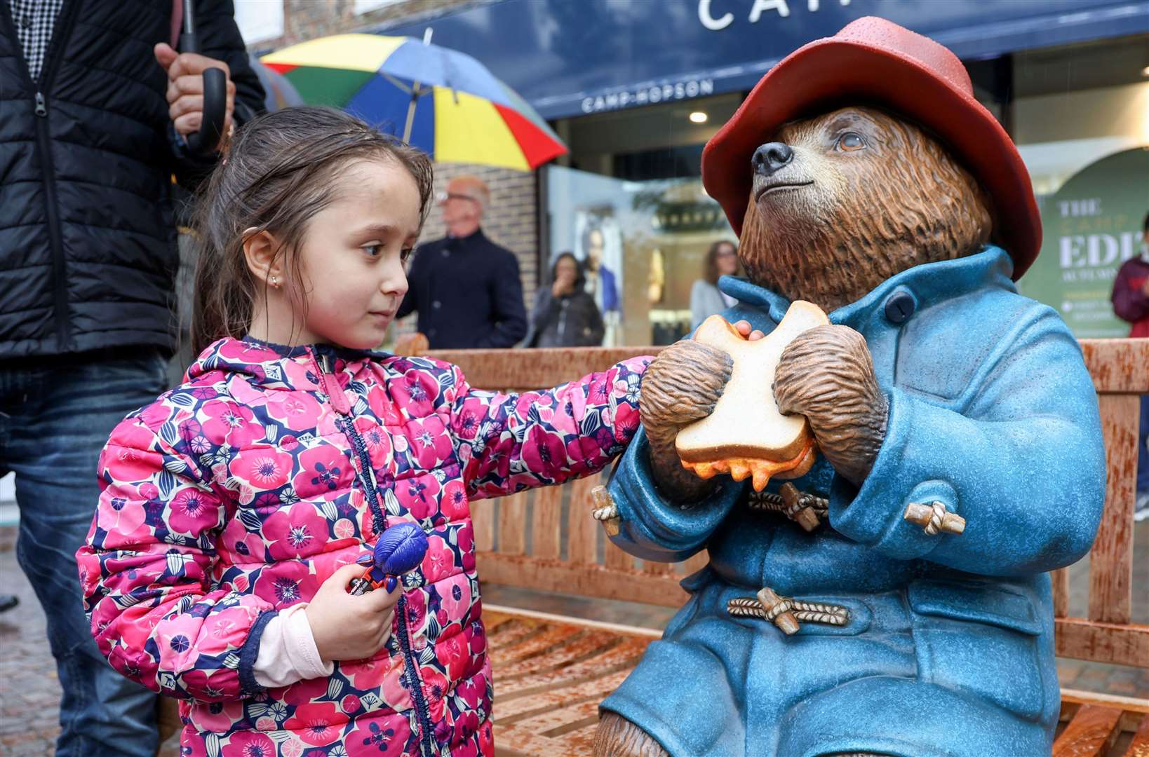 Child welcoming Paddington Bear to Newbury