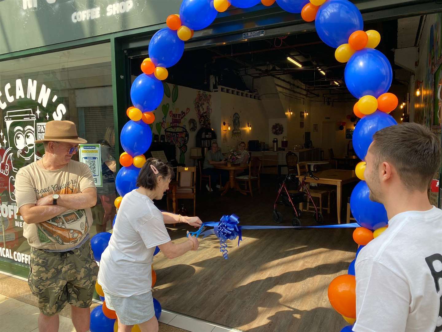Maggie cut the ribbon to officially open McCann's Coffee Shop