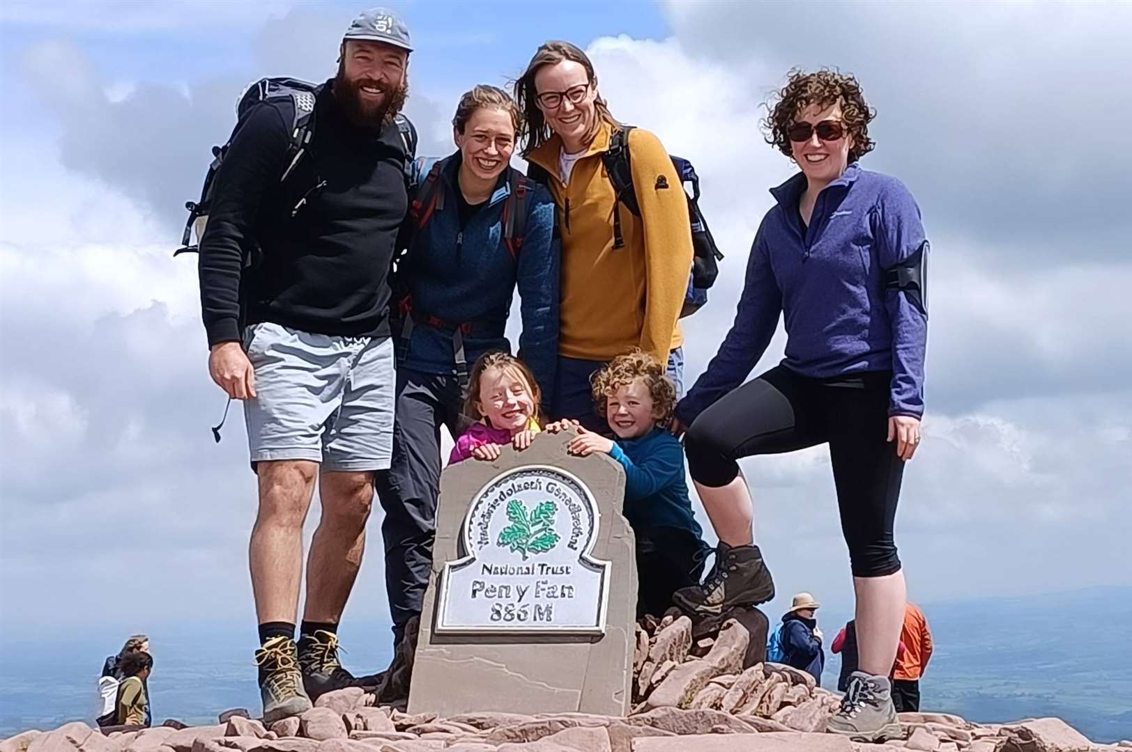 Katy and her friends and family at the summit of Pen Y Fan