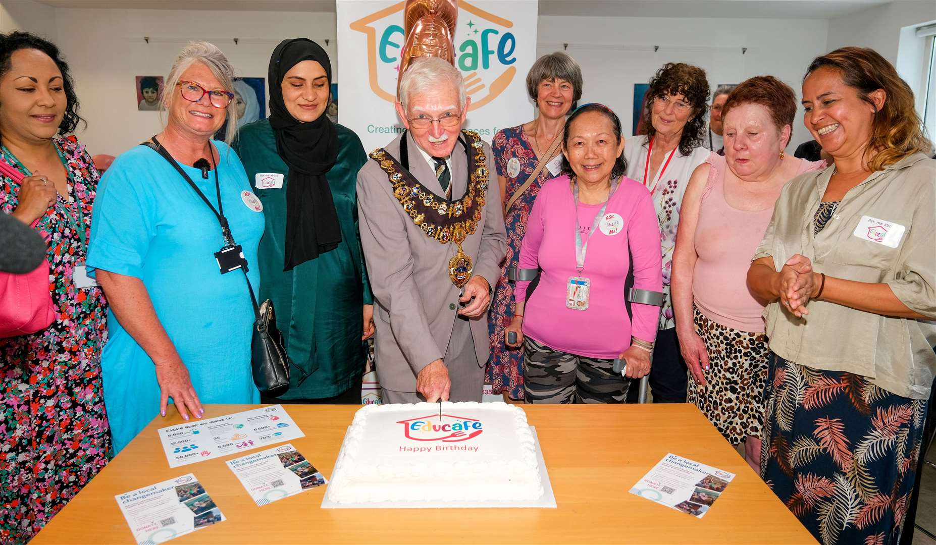 Mayor of Newbury, Andy Moore, cutting the cake for Educafé’s third birthday