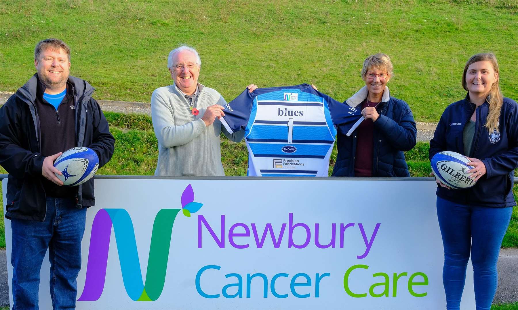 Newbury Rugby Football Club (NRFC) sponsorship manager Robin Varley, chair of Newbury Cancer Care (NCC) Dave Ormrod, NCC director of operations Helen Milroy and NRFC manager Louise Endean