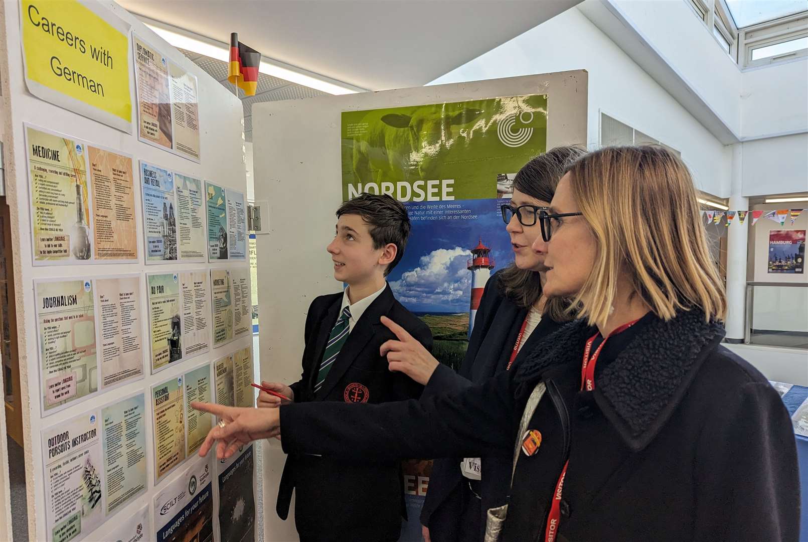 Andrea and Susanne exploring German Week displays with Year 9 pupils