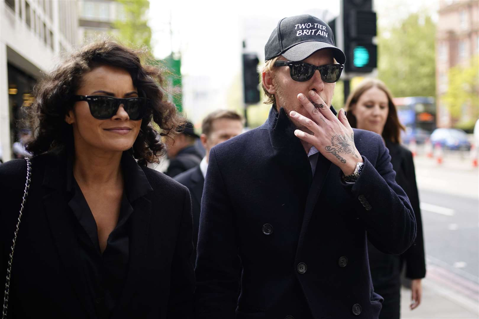 Actor-turned-politician and former GB News presenter Laurence Fox Westminster Magistrates’ Court in central London, with partner Elizabeth Barker (Jordan Pettitt/PA)