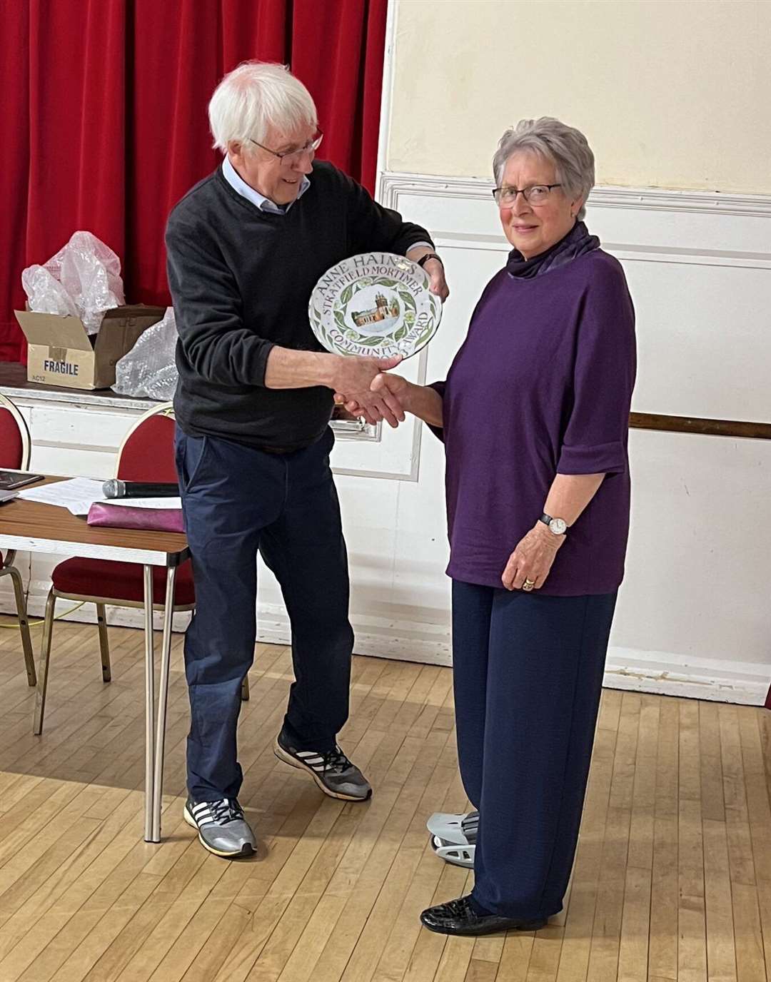 Cllr Mike Dennett presenting Anne Haine her award. Credit: Nick Carter
