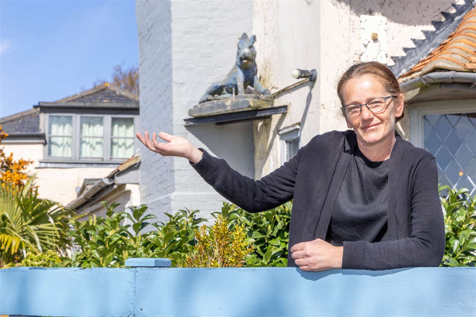 Manager Ella Beer with the blue boar statue