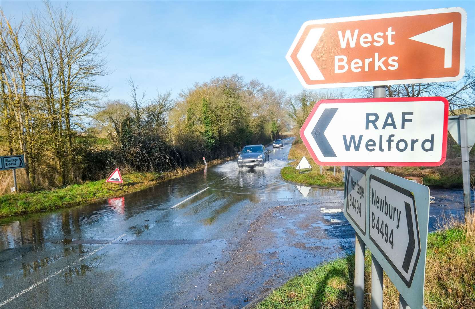 Potholes covered in flood water along B4494