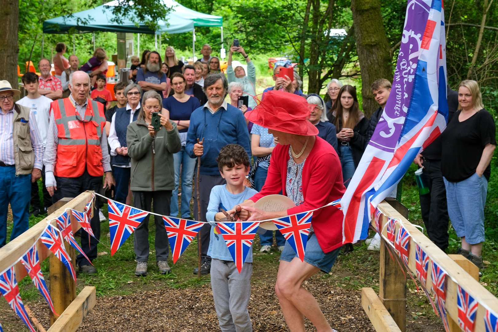 Pat Owen opens the new bridge with help from Felix Roe