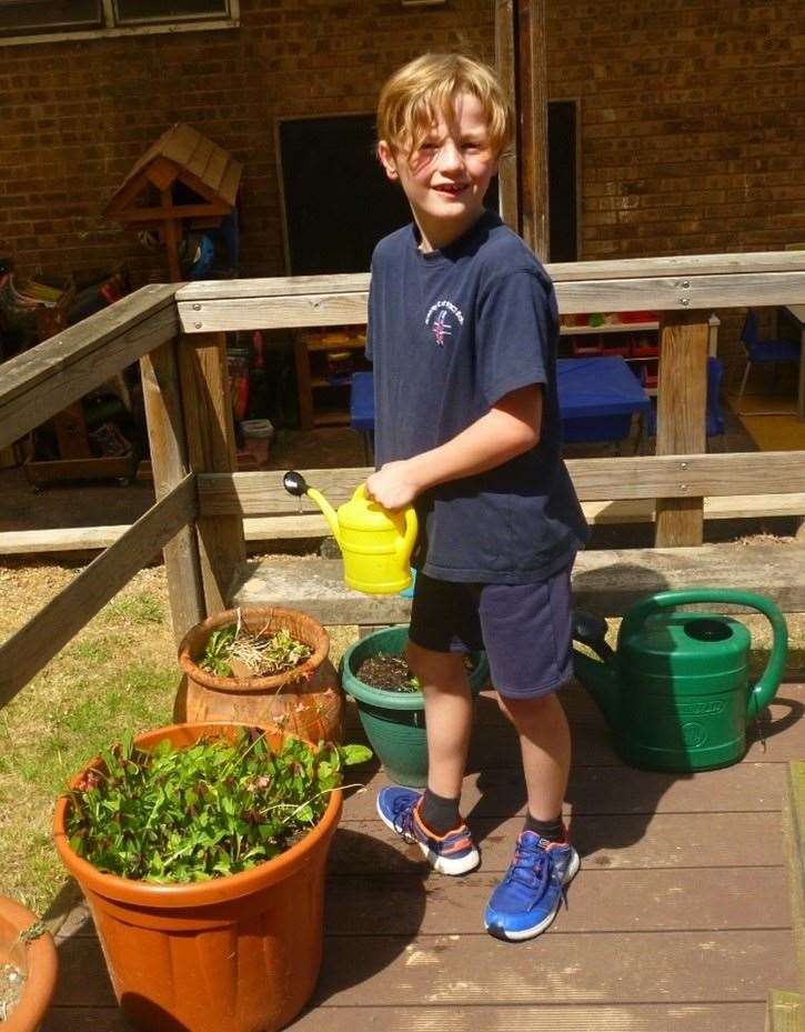 Streatley pupil tending to school garden