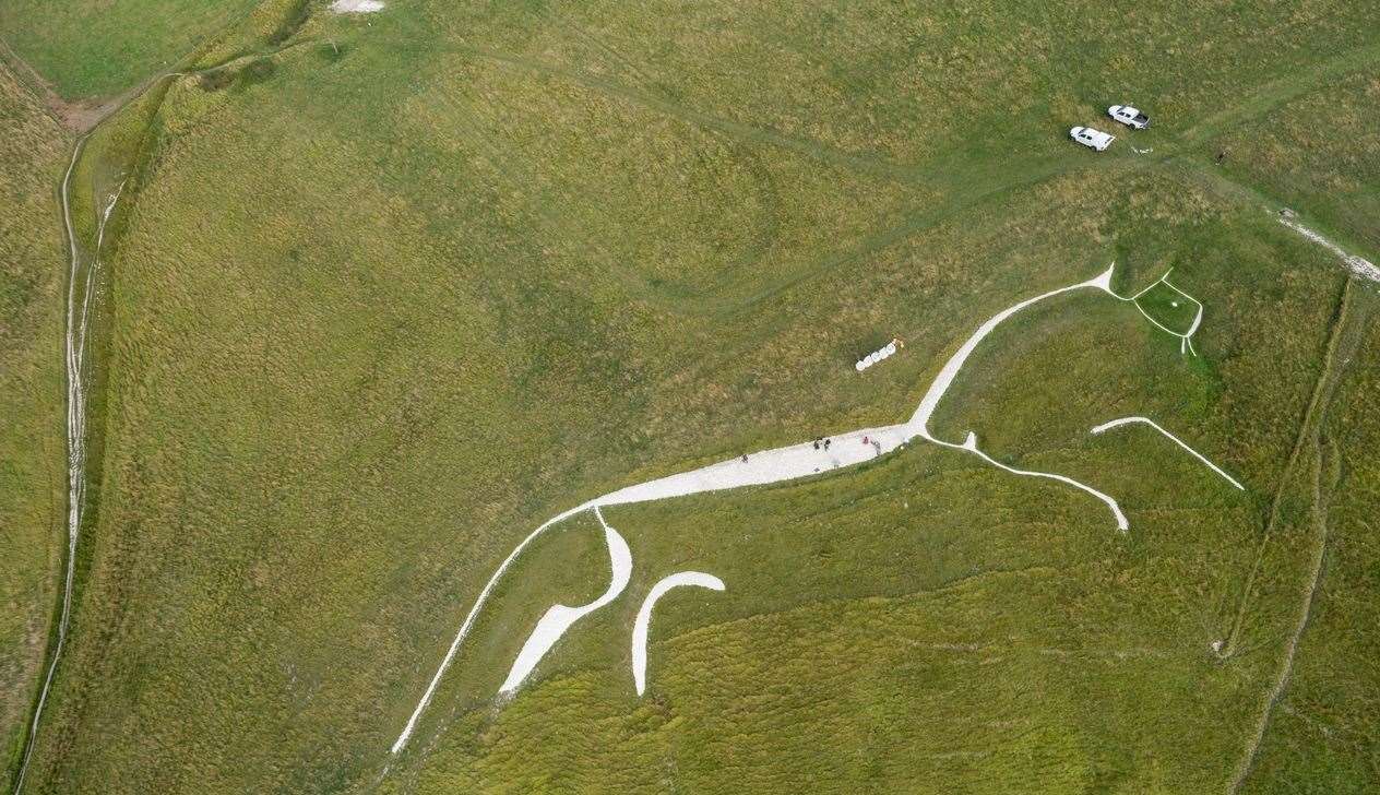 Aerial view of volunteers re-chalking the bronze-age horse figure at White Horse Hill, Oxfordshire Pic: Mike Calnan