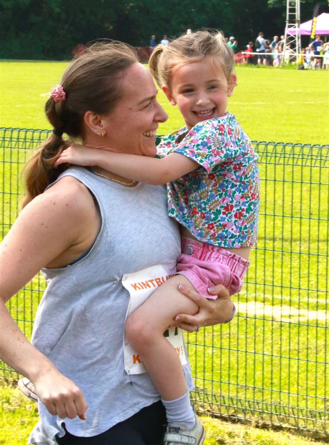 A smiling mother and daughter duo taking part in the junior race, credit: Christopher Culley