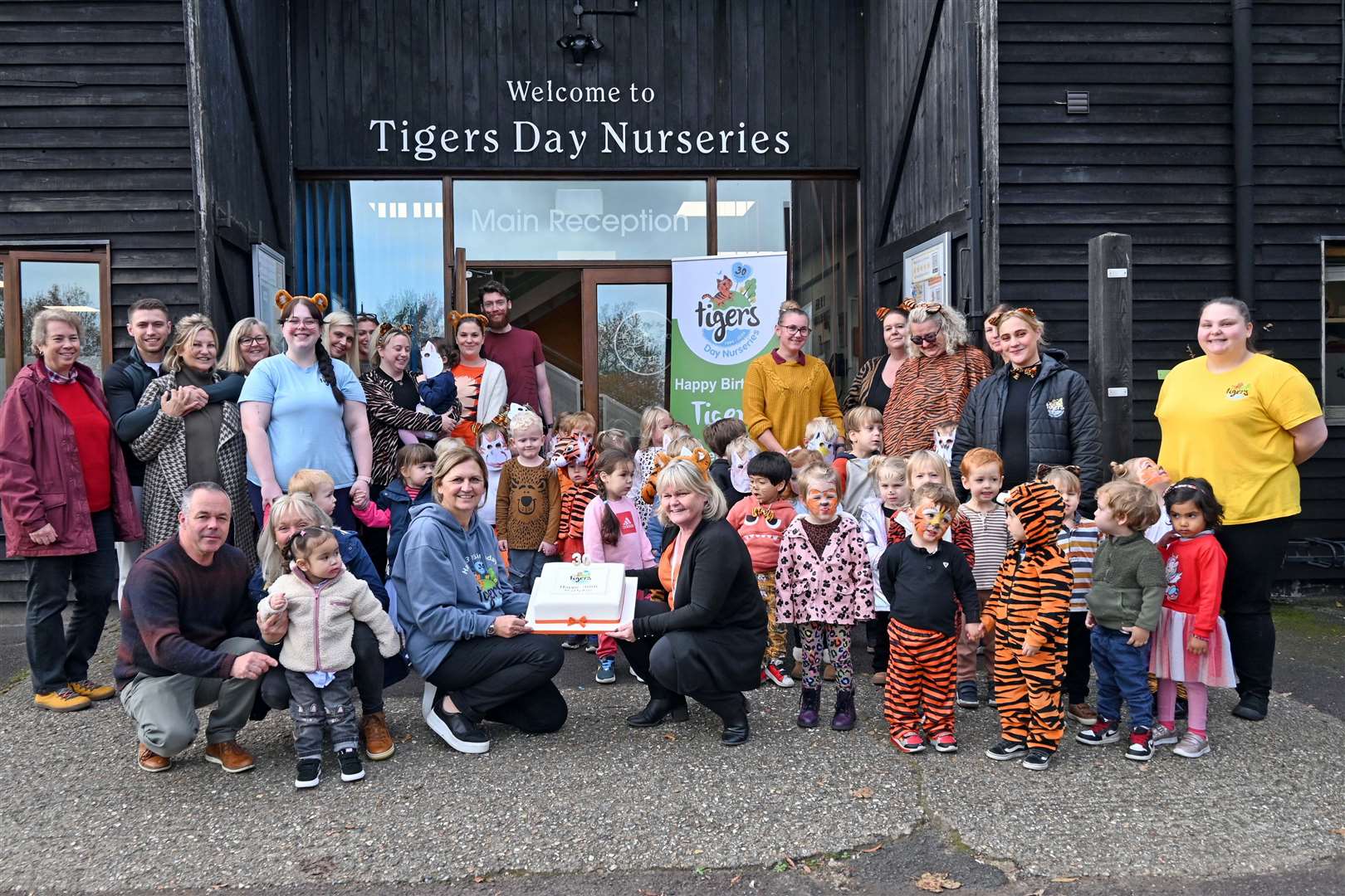 Children and staff celebrating the big milestone