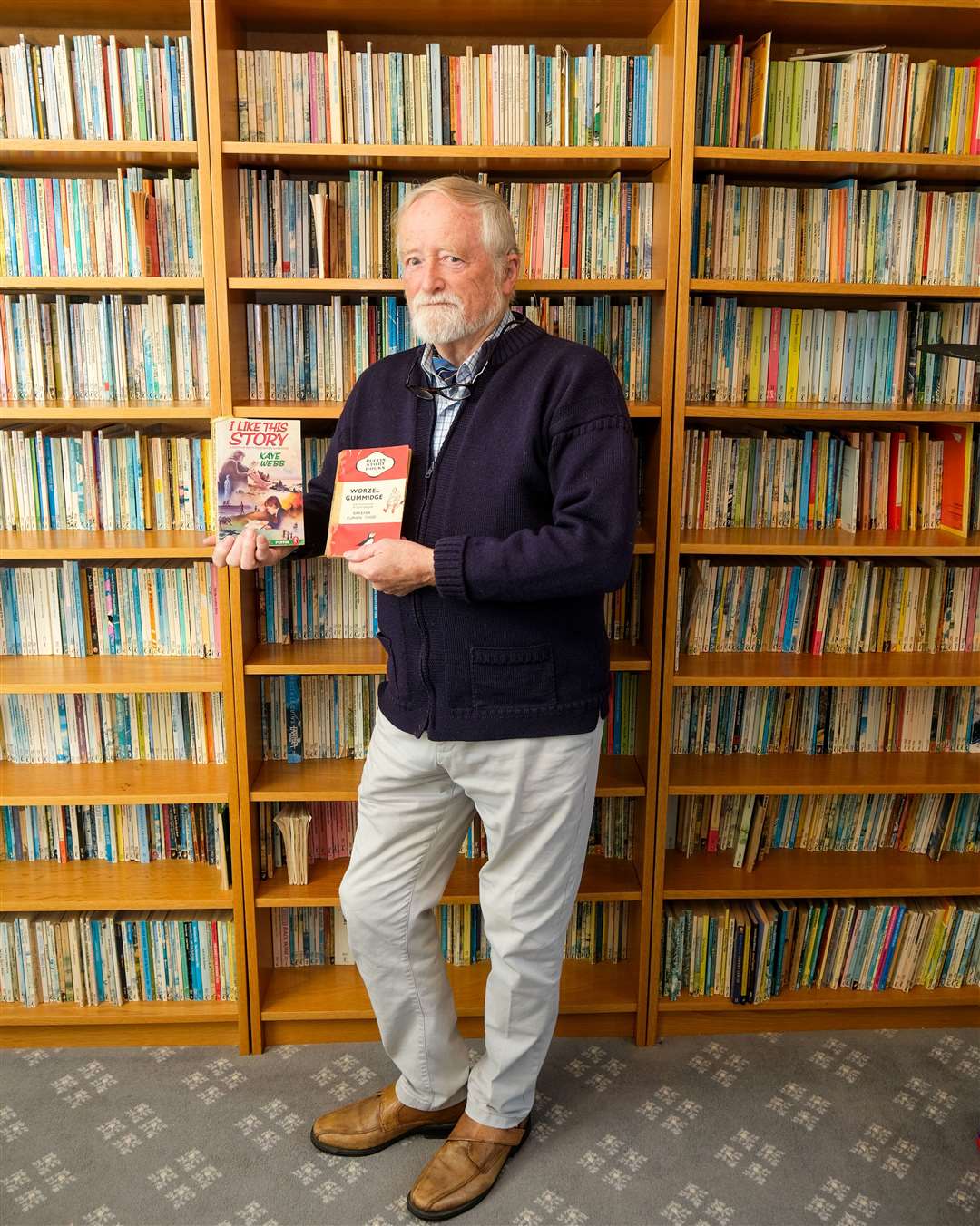 Paul High with the first and 2,000th Puffin story book