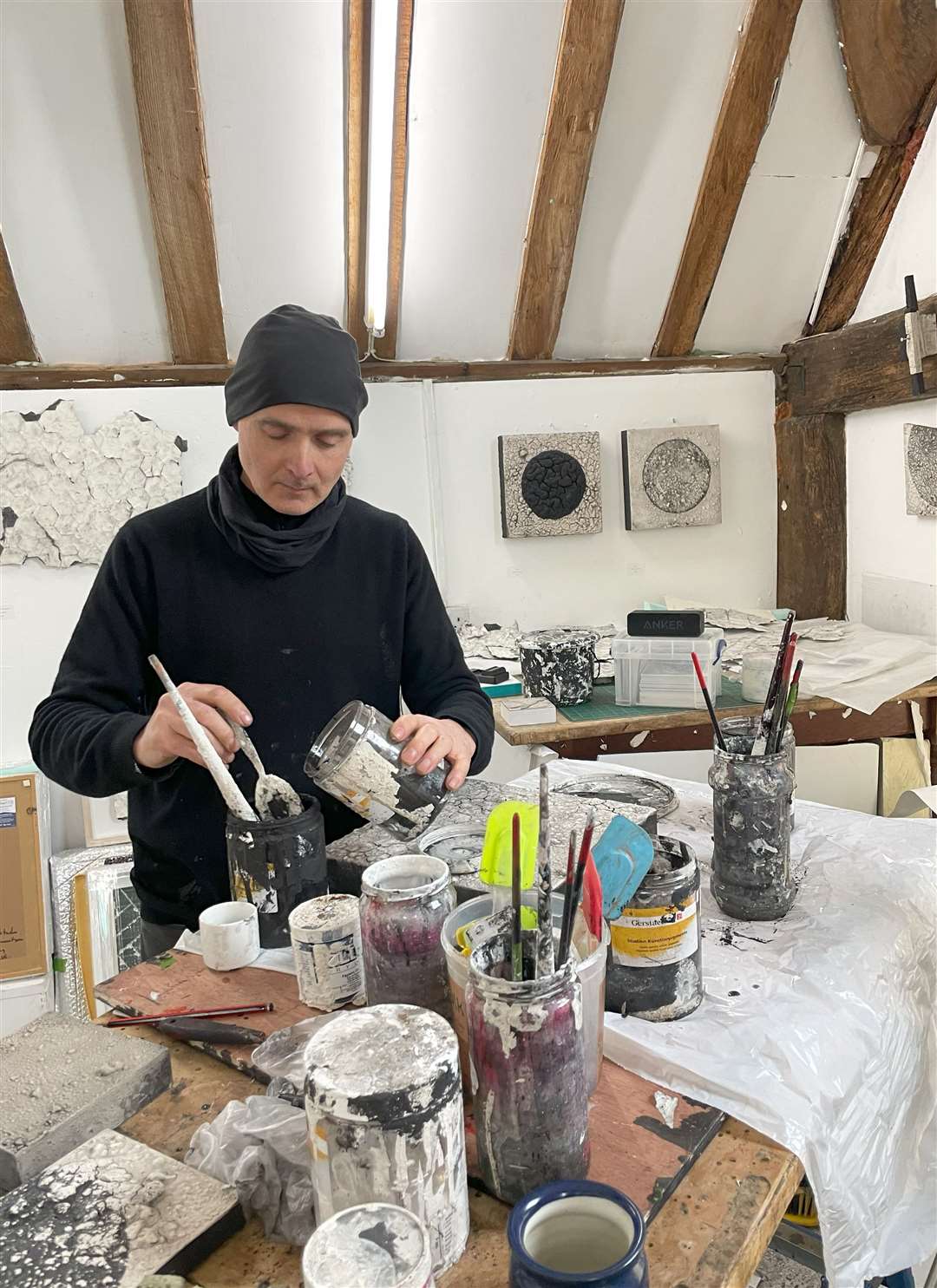 Tom mixes his own paints in his studio in Burghfield